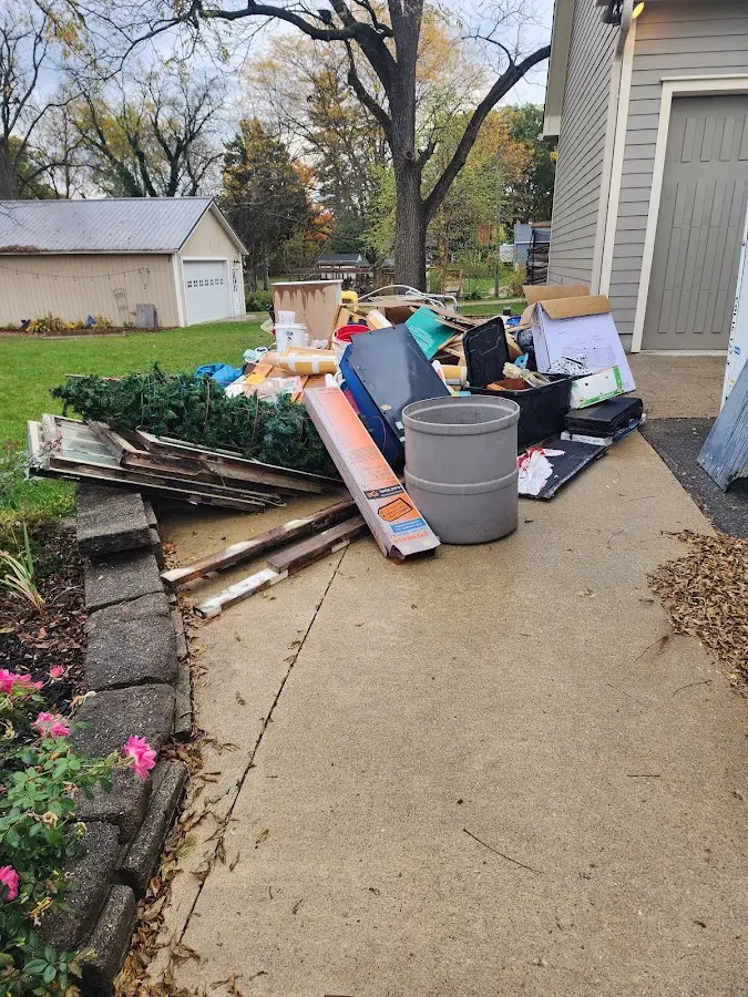 Dumpster being loaded with debris for Commercial Dumpster Rental in Georgetown